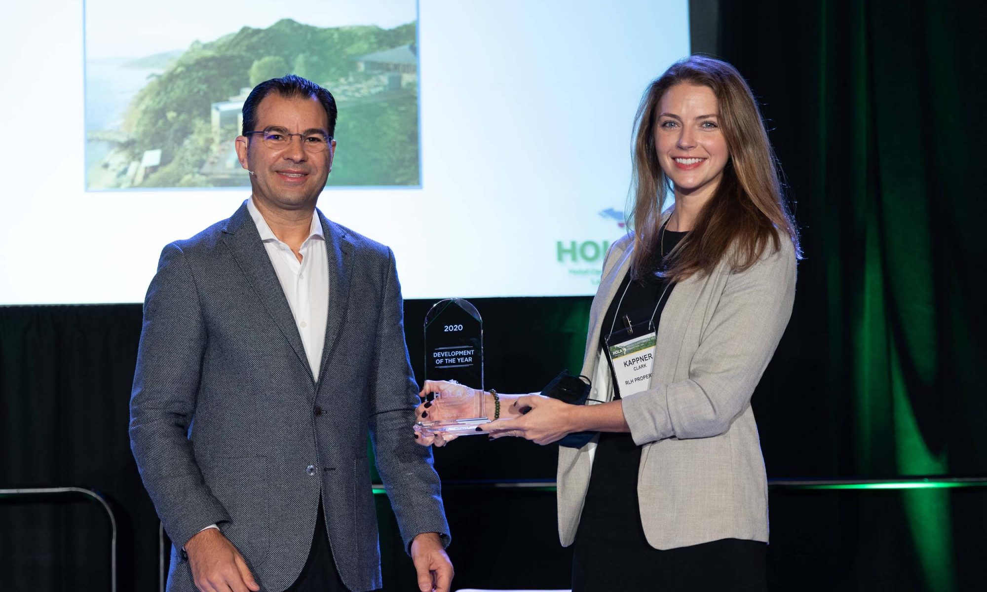 marketing director accepts award at hospitality conference