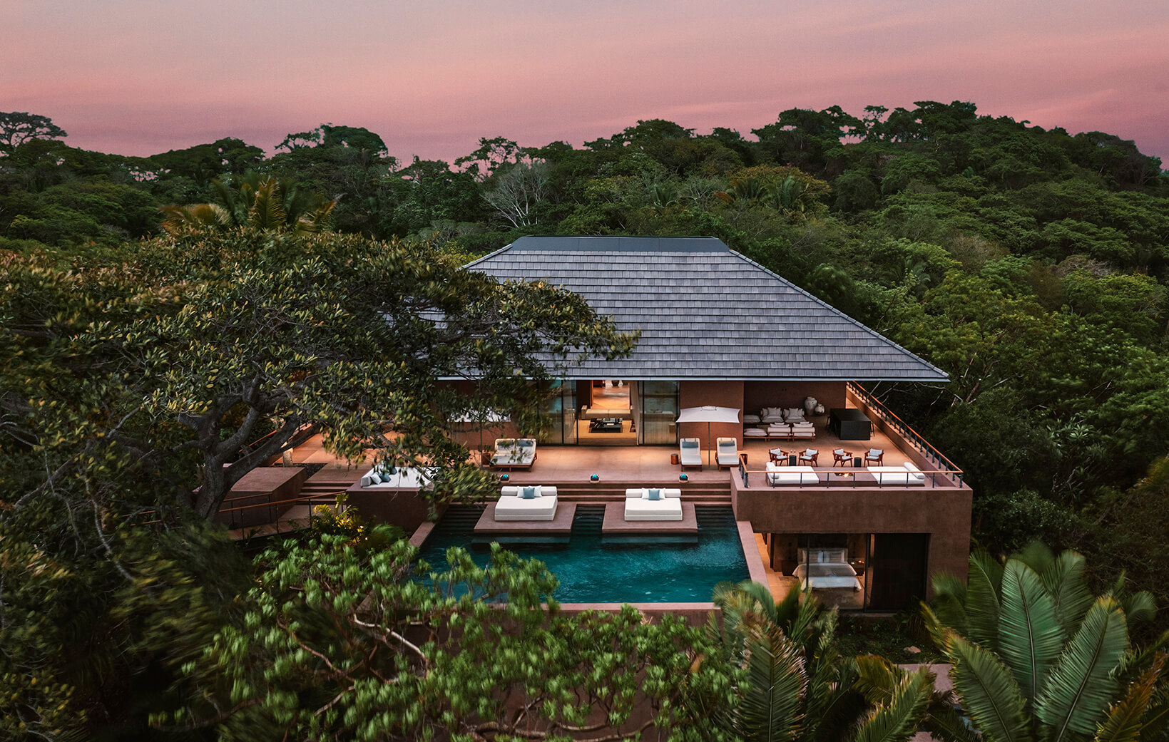 exterior of villa perched in jungle