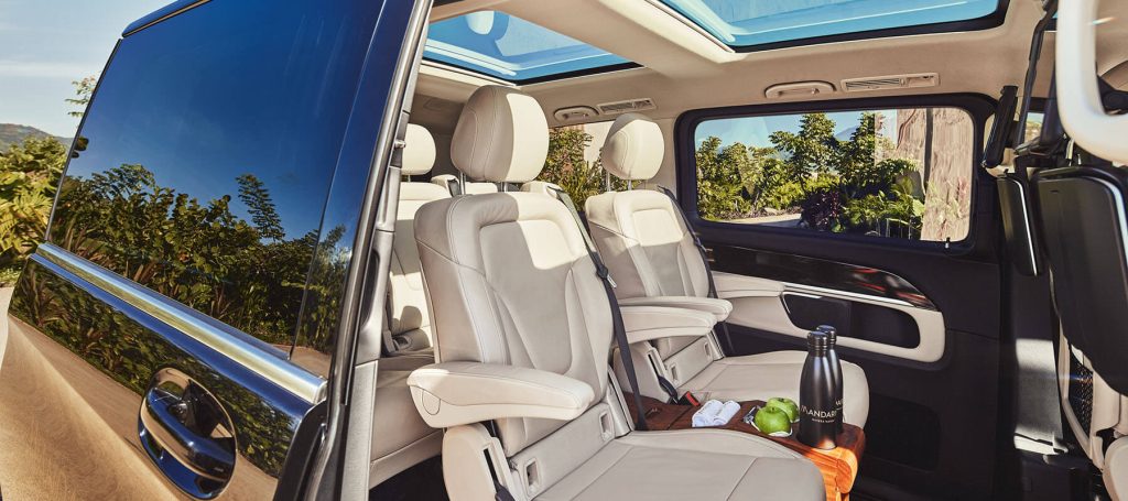 luxury SUV with drinks and snacks await guest airport transport