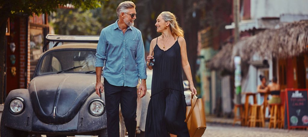 couple talks while walking through cobblestone streets