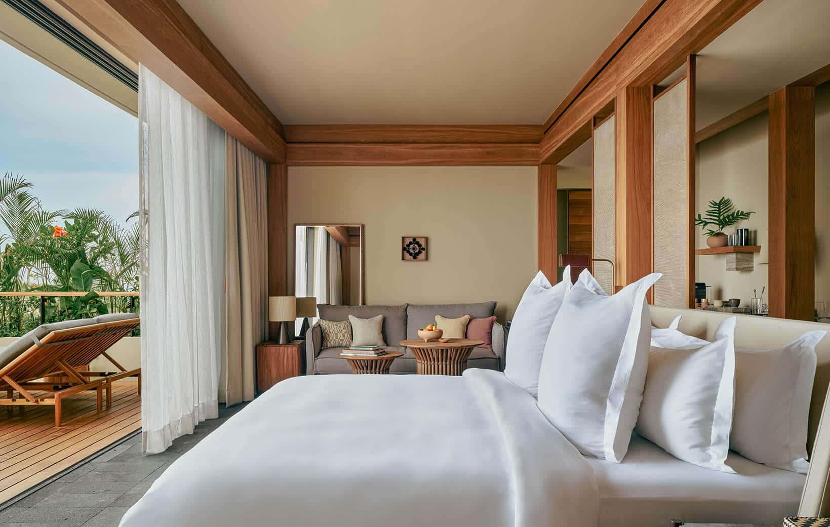 hotel suite opens to private terrace with large window walls