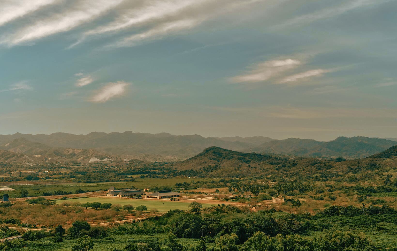 flatlands at mandarina with lush fields and mountain views