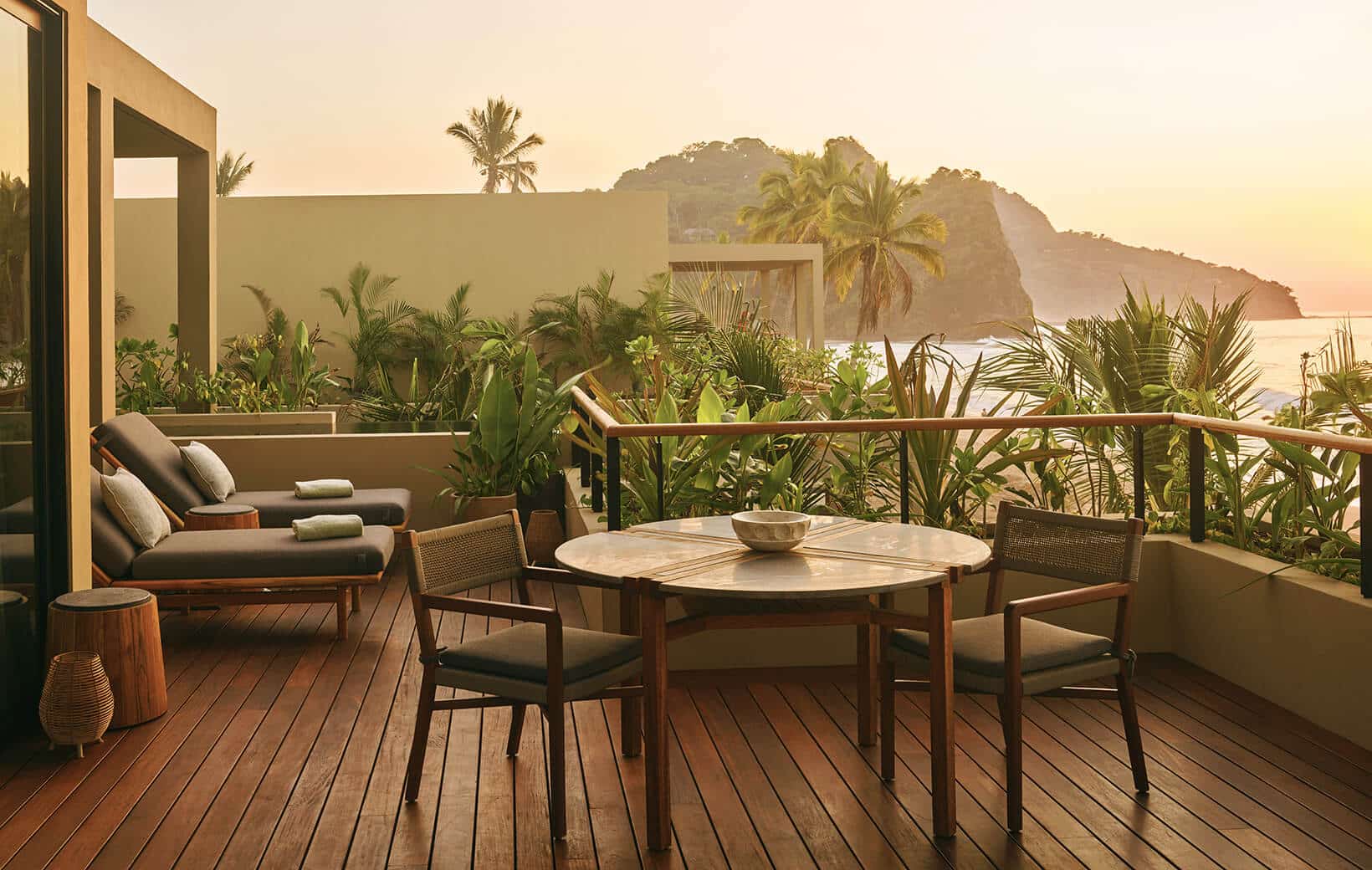 large hotel terrace with private dining table and lounges