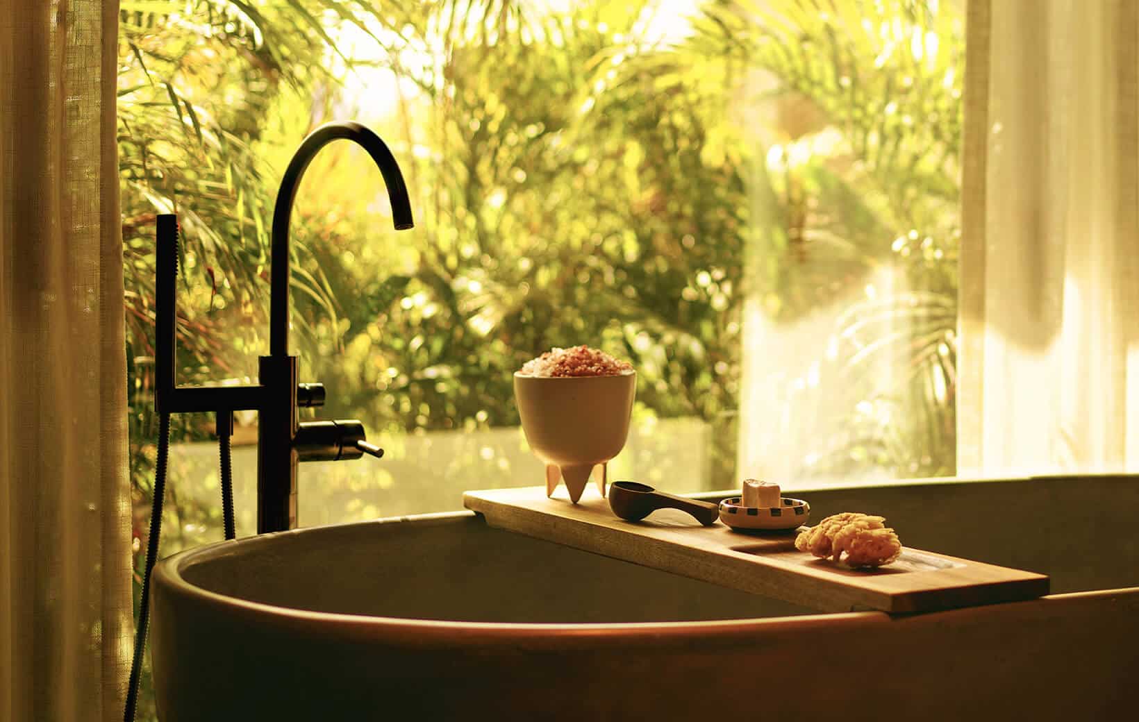 spa bathtub at rosewood mandarina with accessories