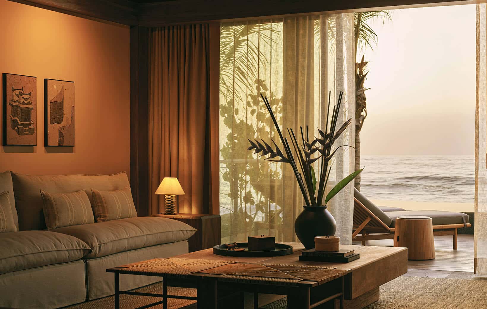 living room hotel suite opens to private terrace and ocean view