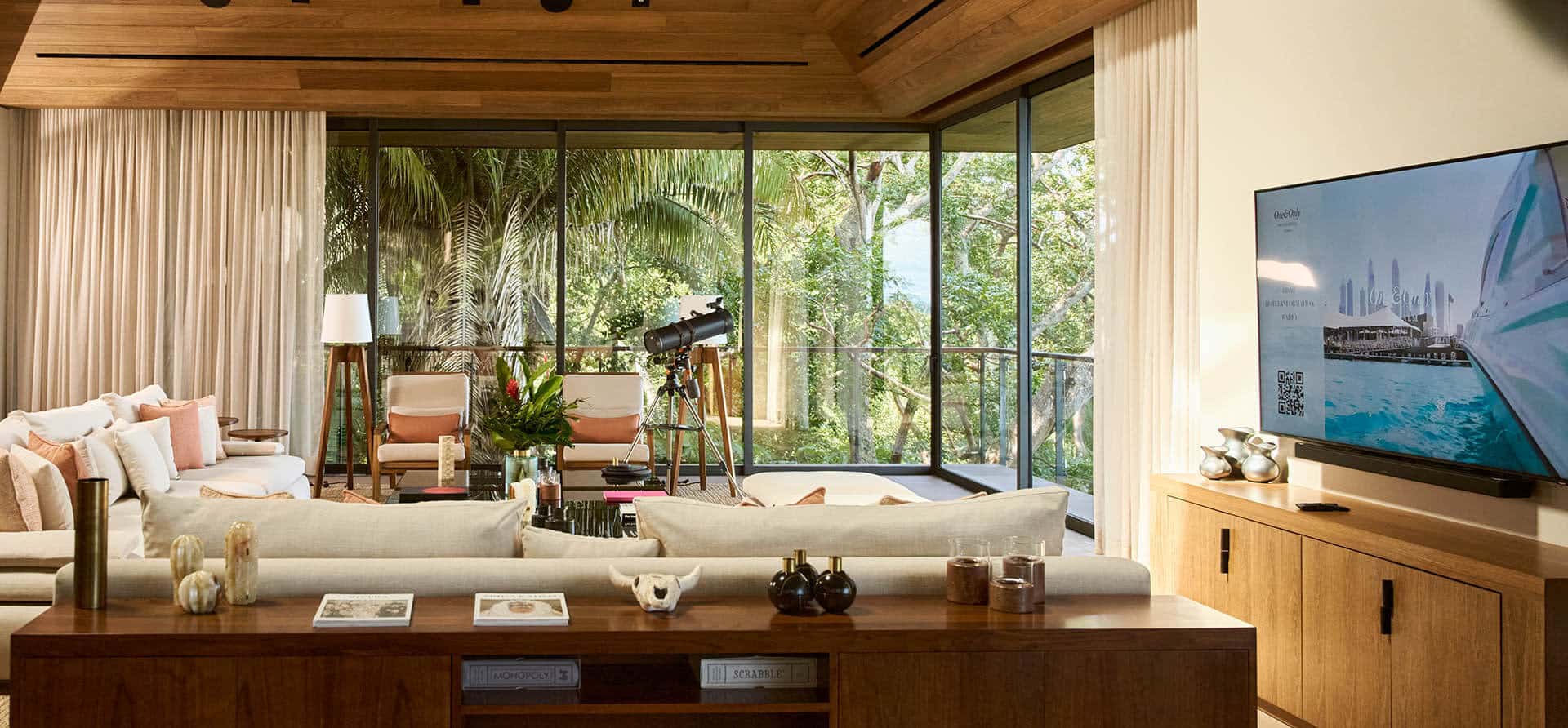 living room in mandarina jungle with large window views